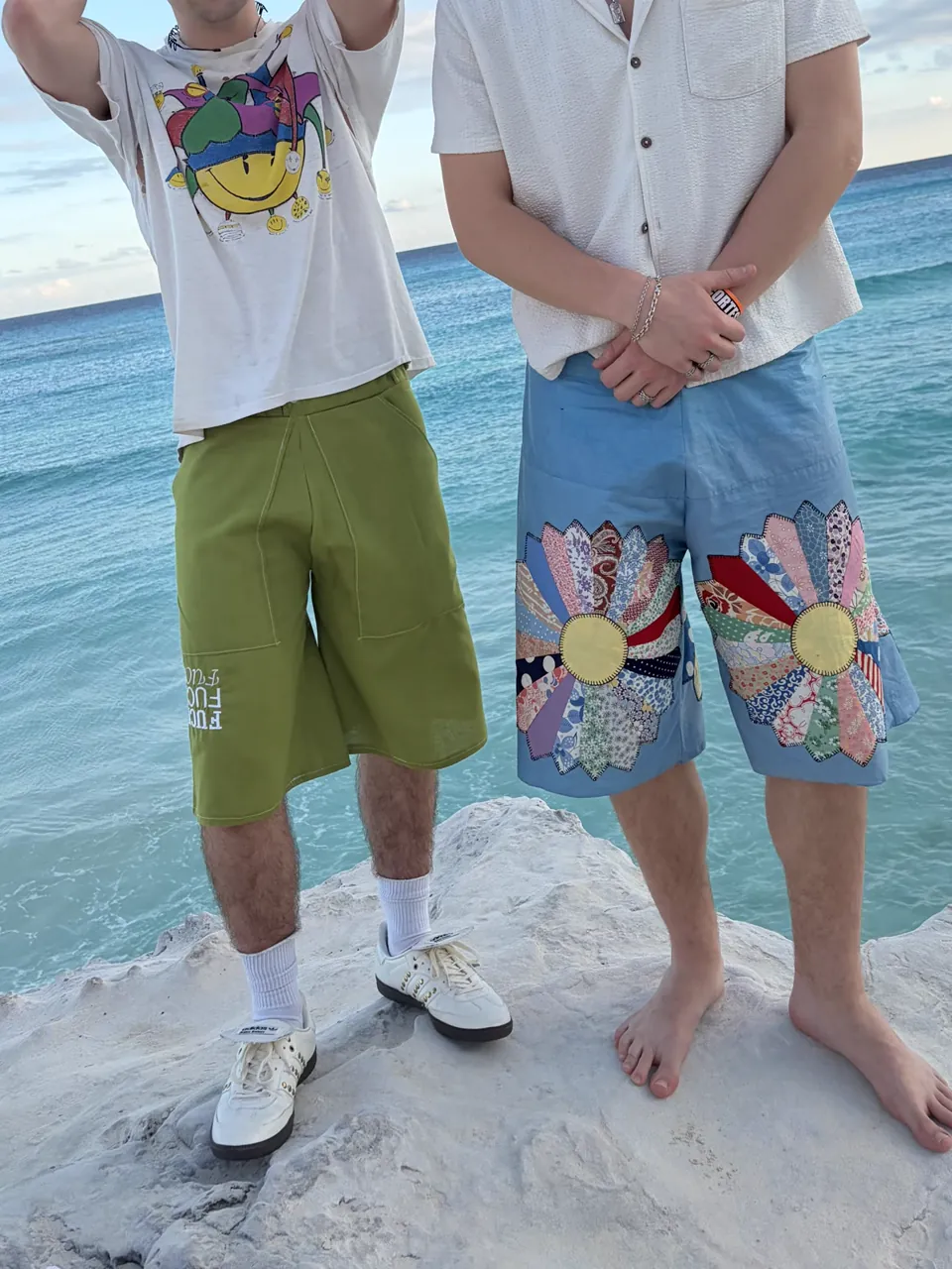 Linen shorts — worn with a shredded graphic tank, against an evening sky