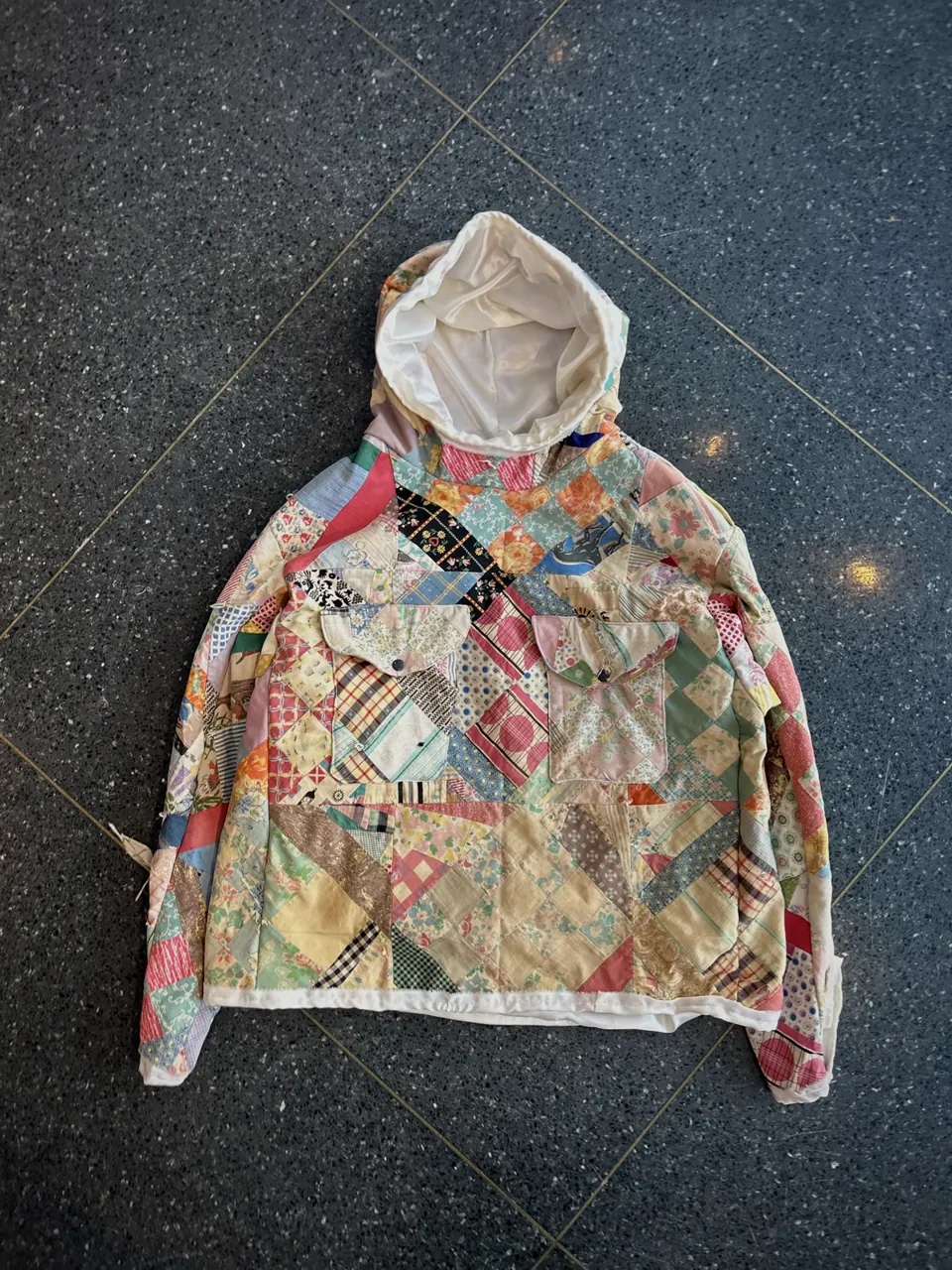Pastel patchwork hoodie pieced from floral scraps, hood lined in white satin